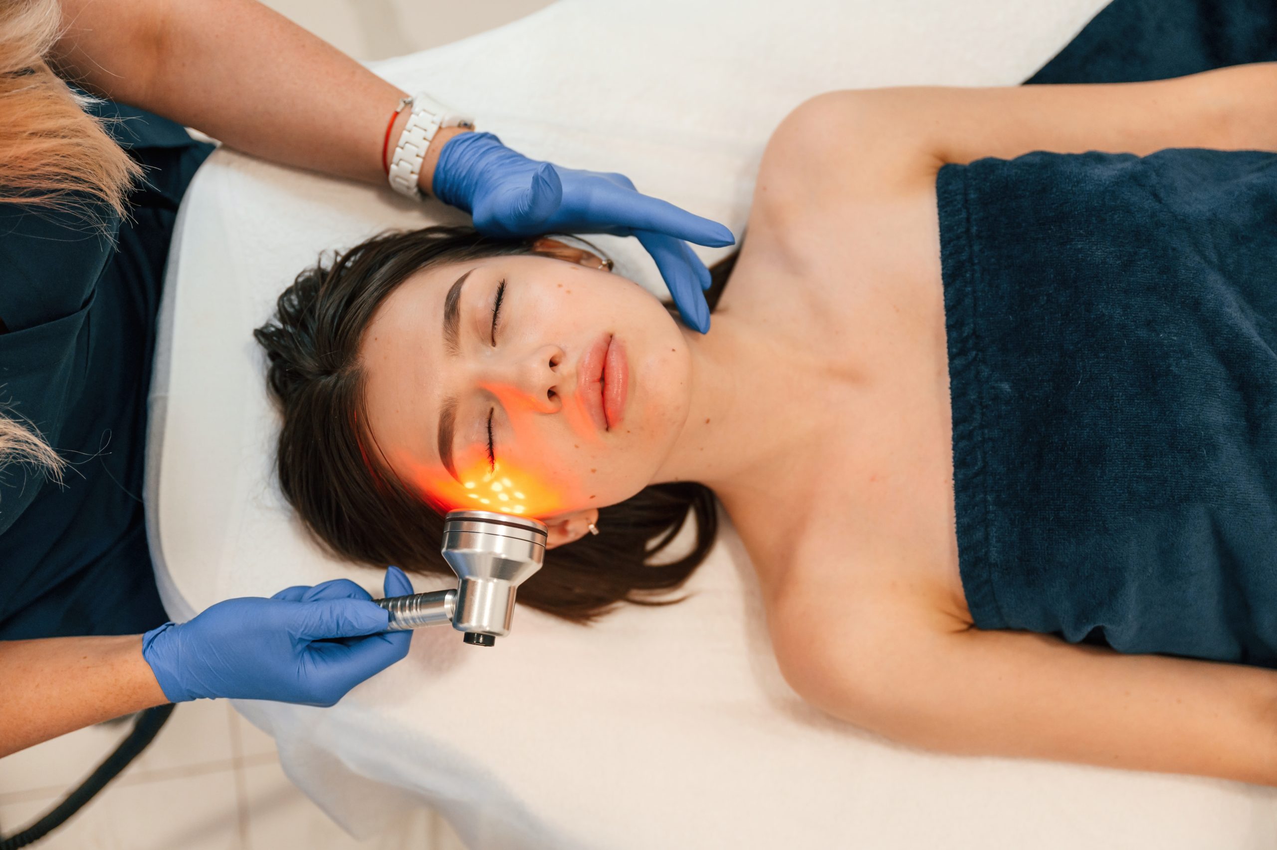 Cosmetologist does injection for lips augmentation. Women's cosmetology in the beauty salon.